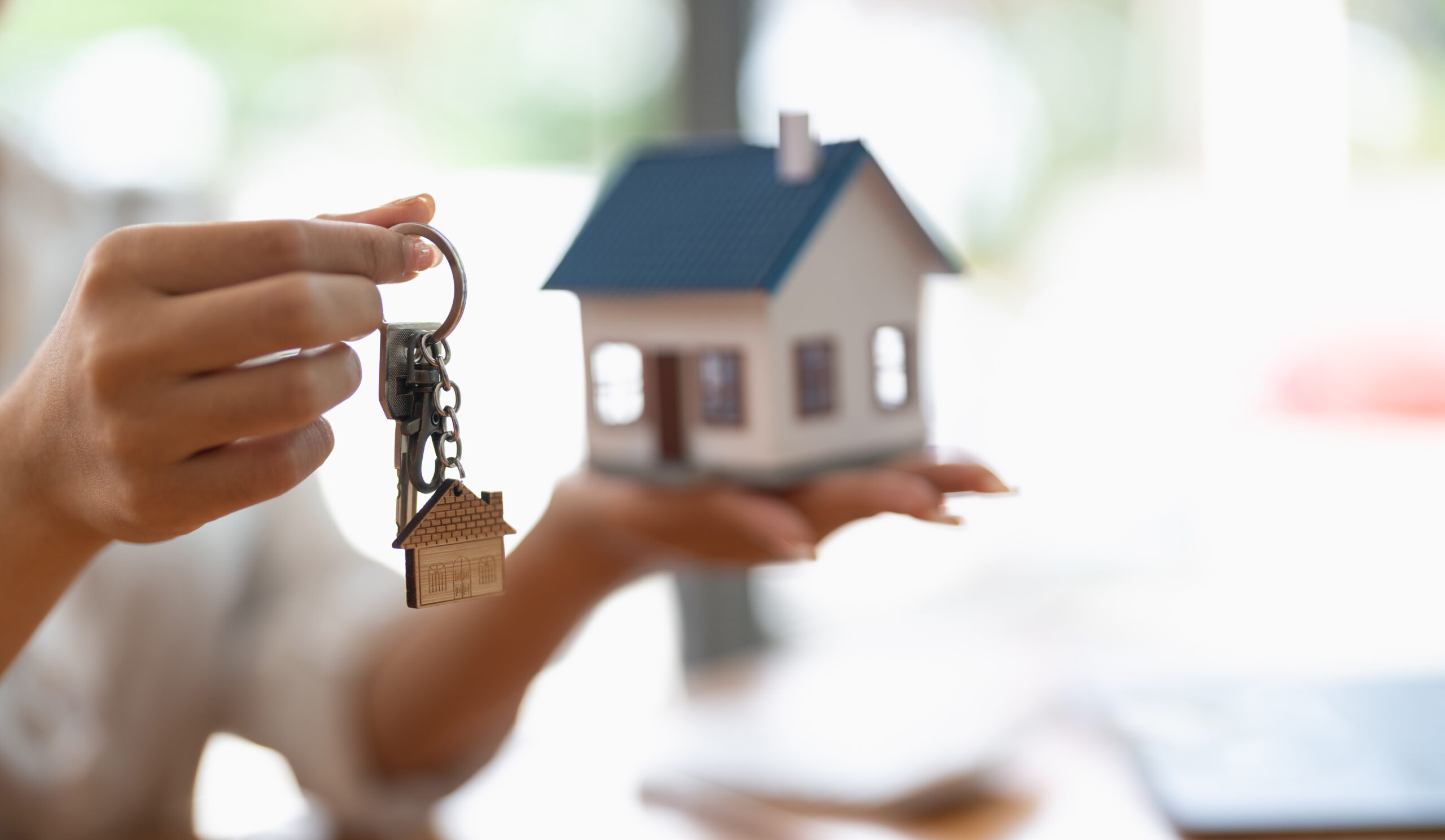 Real estate agent handing over keys to home